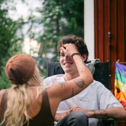 Volunteers engaging in community projects in Sweden, surrounded by lush greenery